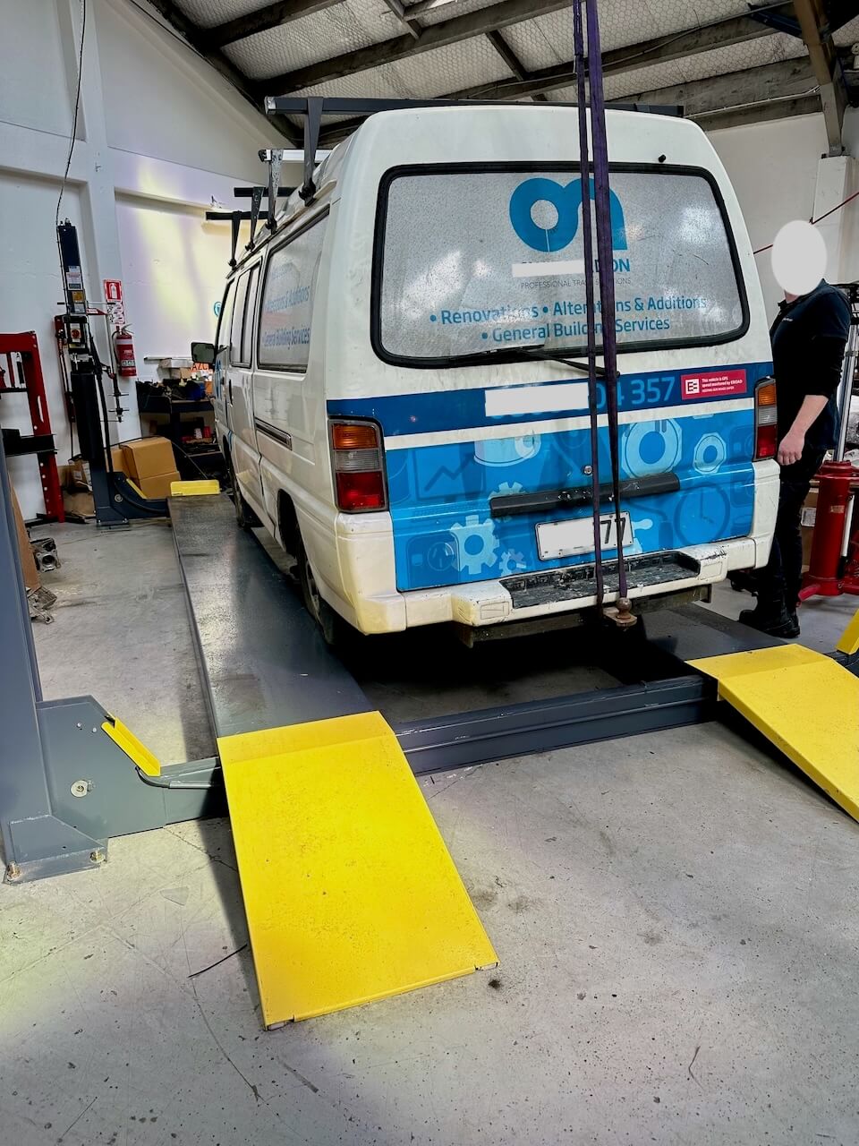 Van almost rolling off hoist