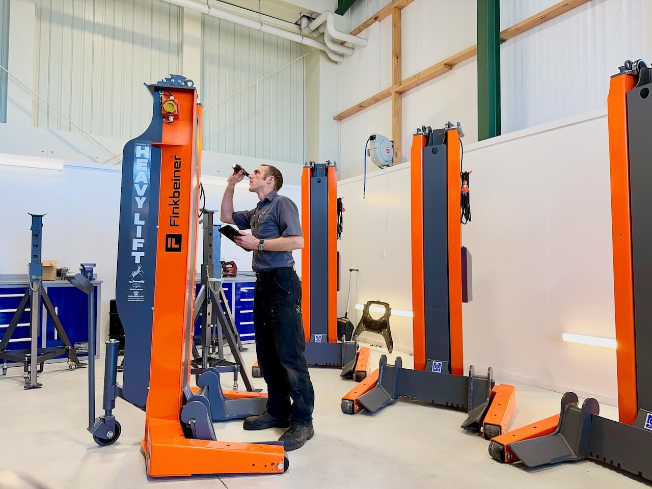 Technician inspecting hoist