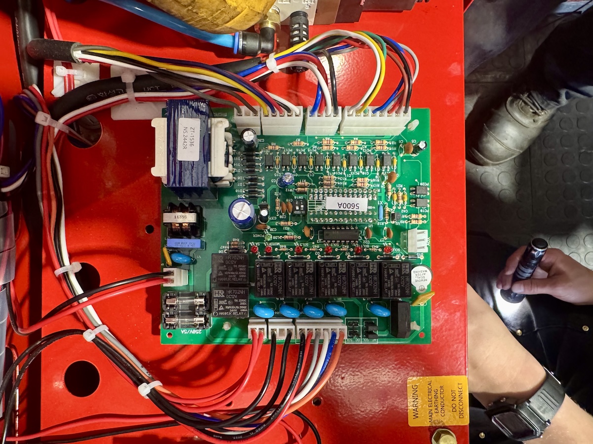 Technician diagnosing equipment